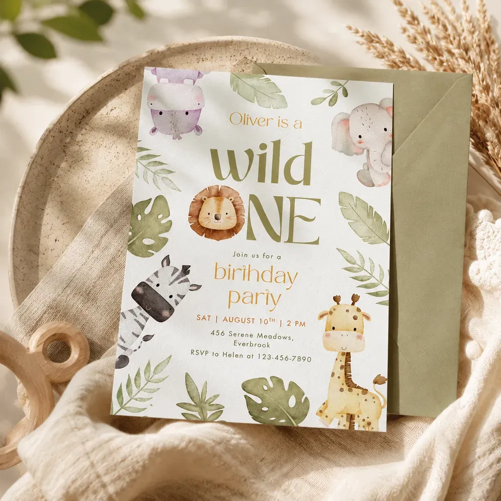 The same invitation in the same setting, now beside a sage green envelope that matches the foliage in the design