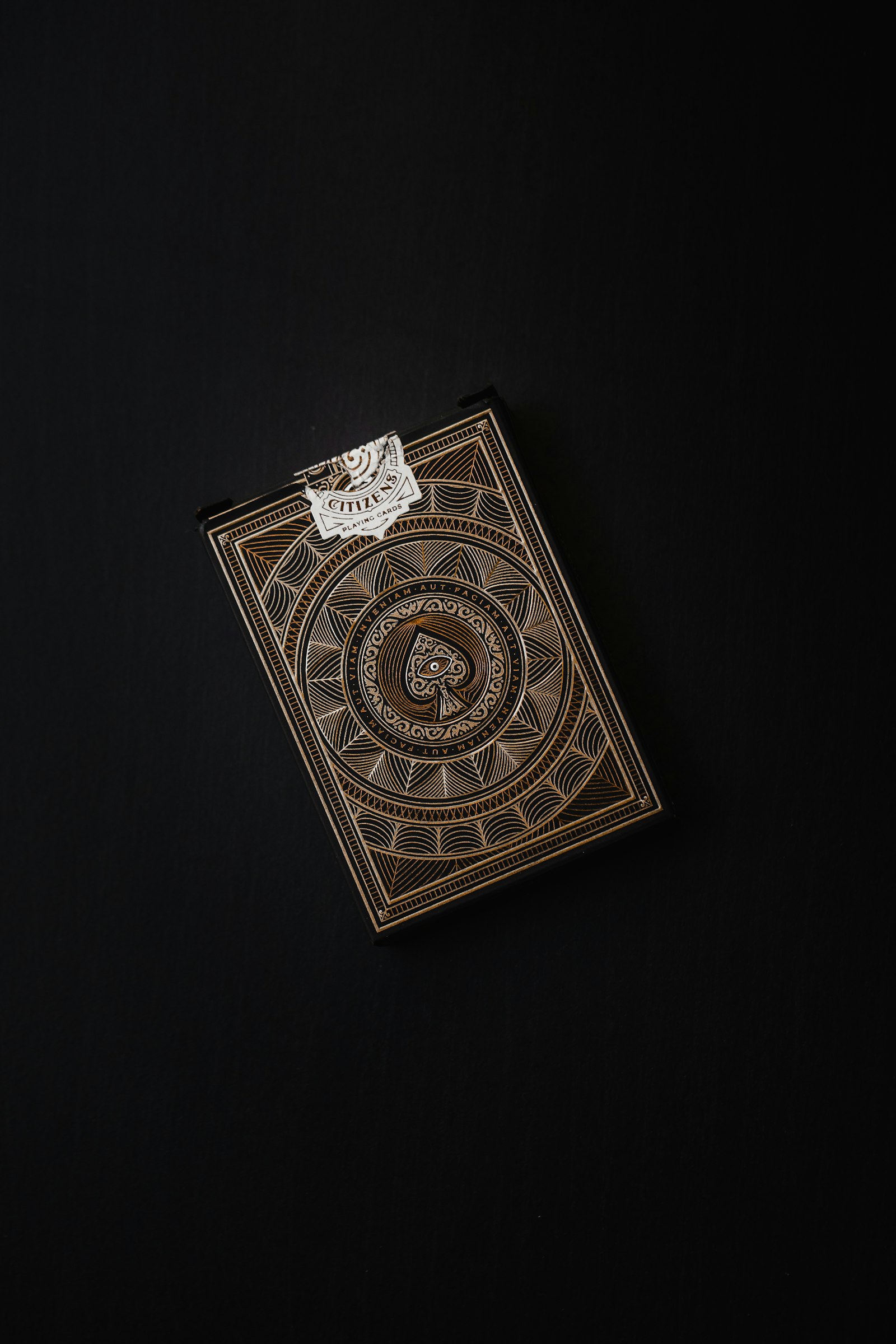 A luxury deck of playing cards photographed on a clean white surface